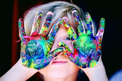 Image of Child with paint on hands